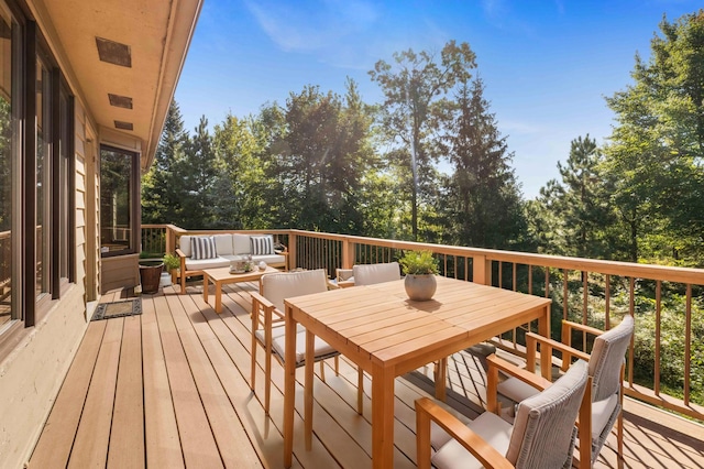 wooden terrace featuring an outdoor hangout area