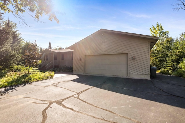 view of property exterior with a garage