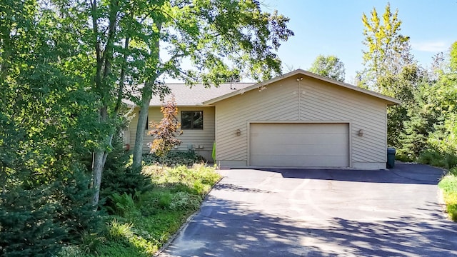 ranch-style house featuring a garage