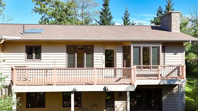 rear view of house with a deck