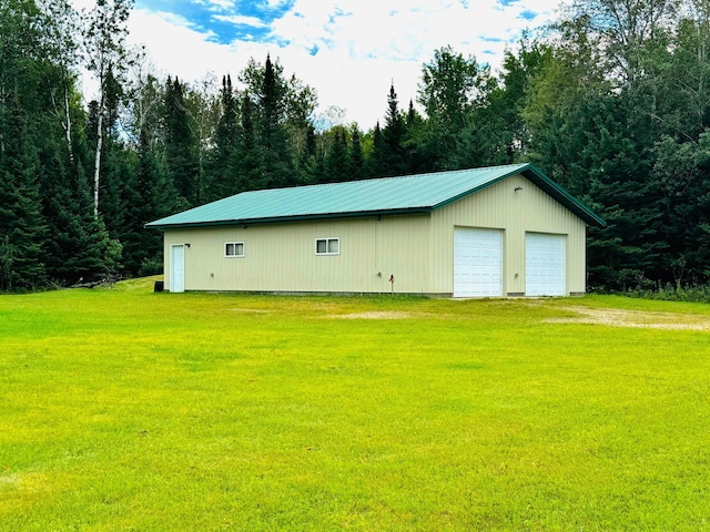 garage with a yard