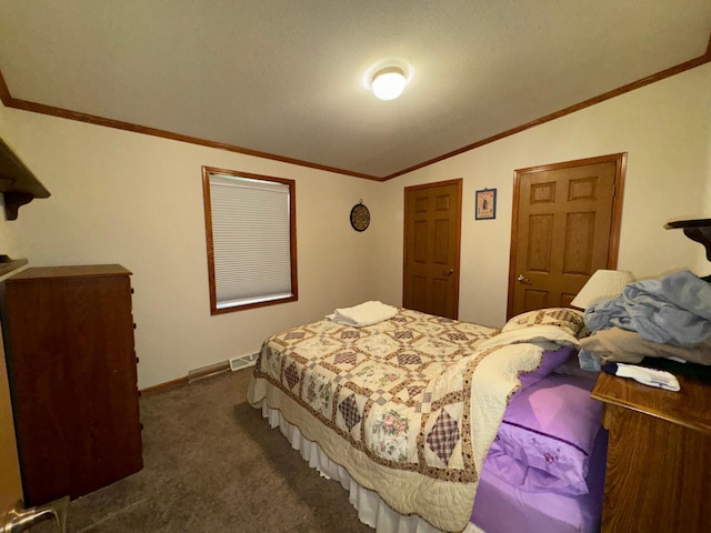 carpeted bedroom with lofted ceiling, a textured ceiling, and ornamental molding