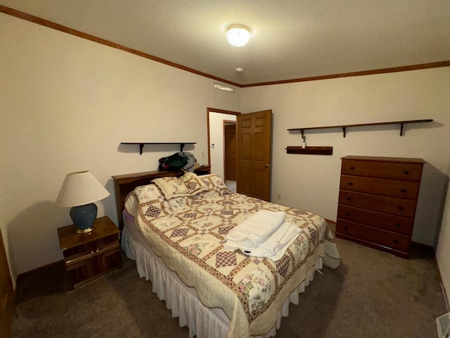 bedroom featuring a textured ceiling, dark colored carpet, and ornamental molding