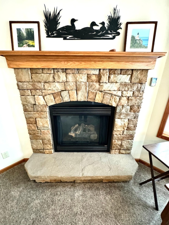 interior details featuring carpet and a fireplace