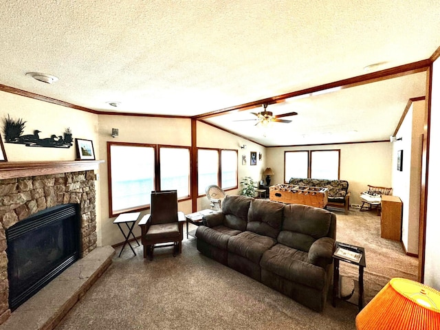 living room featuring a stone fireplace, a textured ceiling, crown molding, and carpet floors