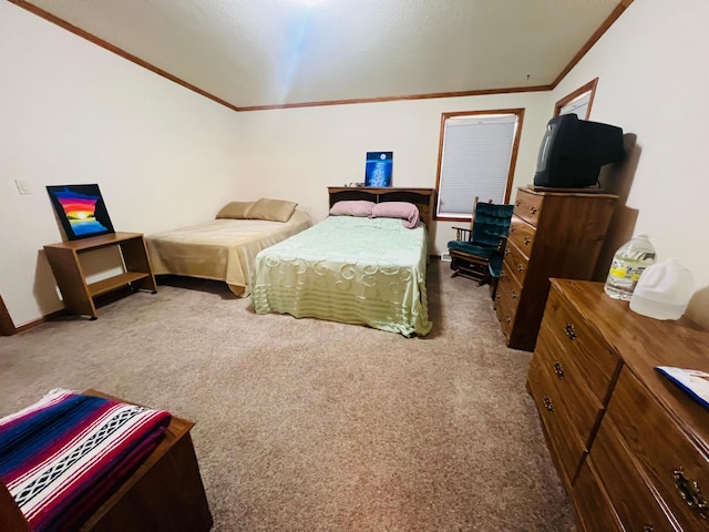 carpeted bedroom with crown molding and vaulted ceiling