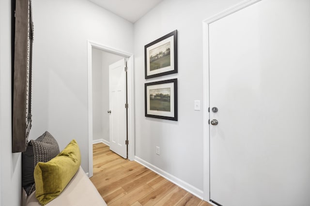 hallway with wood-type flooring