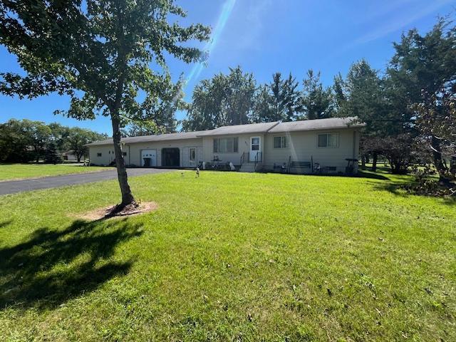 671 Centennial Dr S, Long Prairie, MN 56347 - ranch-style home with a front yard, an attached garage, and driveway