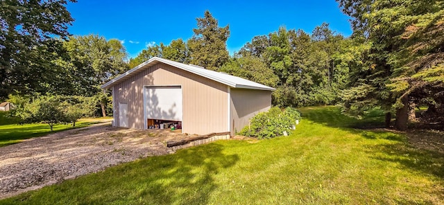 view of outbuilding with a yard