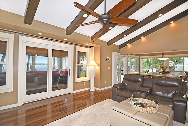 living area featuring recessed lighting, wood finished floors, visible vents, baseboards, and beam ceiling