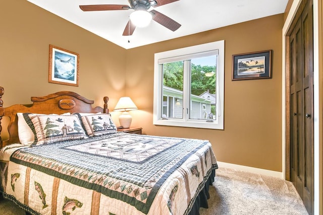 bedroom with ceiling fan, a closet, baseboards, and carpet flooring