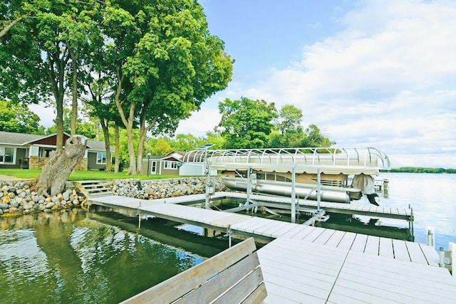 dock area featuring a water view and boat lift