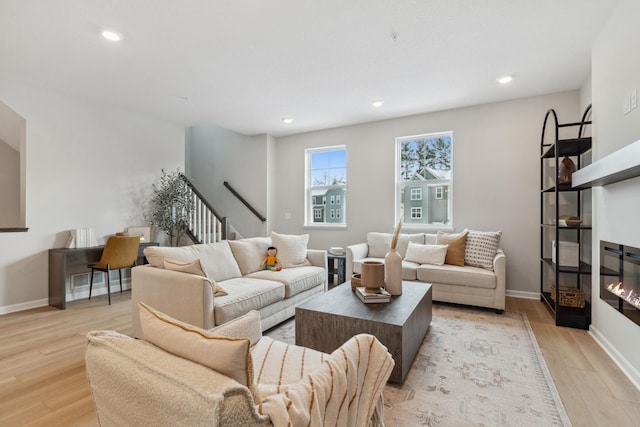 living room with light hardwood / wood-style flooring