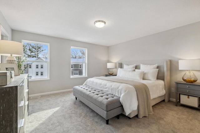 bedroom with light carpet