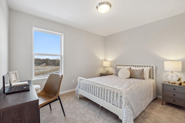 bedroom featuring light carpet