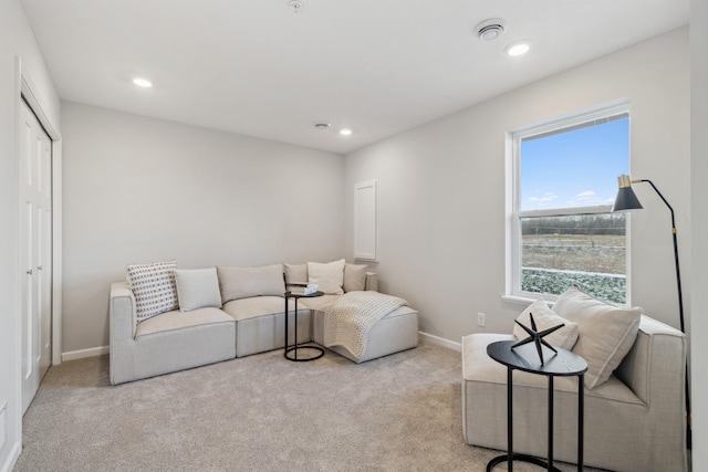 living room featuring light carpet