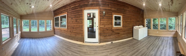 unfurnished sunroom featuring lofted ceiling and wooden ceiling