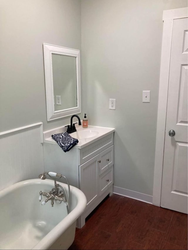 bathroom with vanity and a tub to relax in