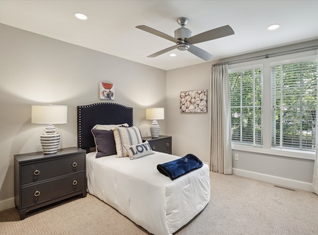 carpeted bedroom featuring ceiling fan