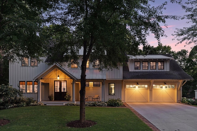 20545 Linwood Rd, Deephaven, MN 55331 - modern farmhouse style home with driveway, a front yard, a garage, board and batten siding, and covered porch
