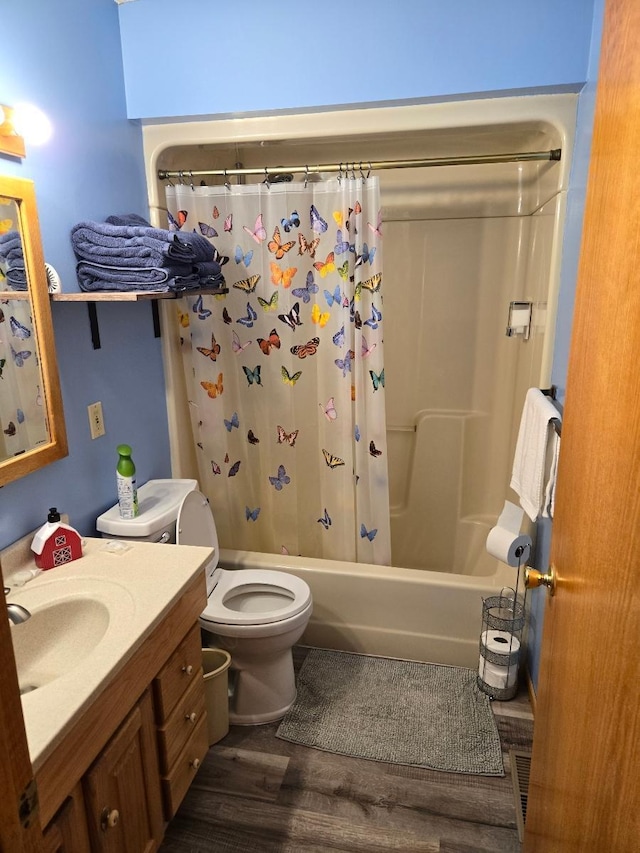 26451 US-71, Arago Twp, MN 56470 - full bath featuring toilet, wood finished floors, vanity, and shower / tub combo with curtain