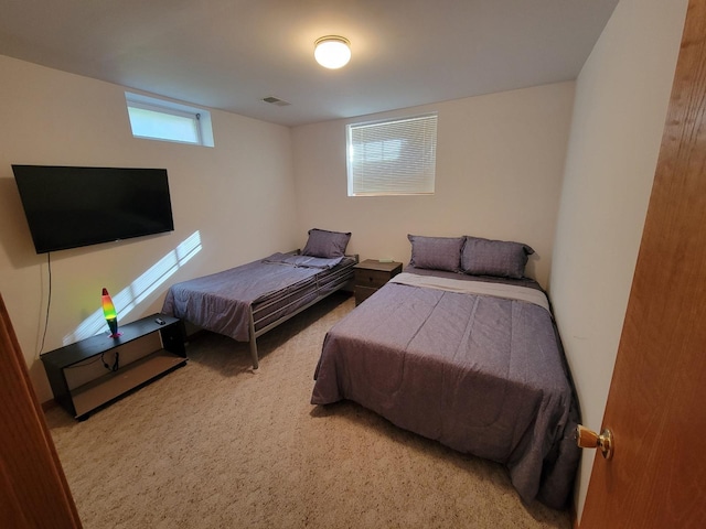 carpeted bedroom with visible vents