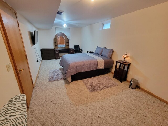 bedroom featuring baseboards, visible vents, and carpet floors