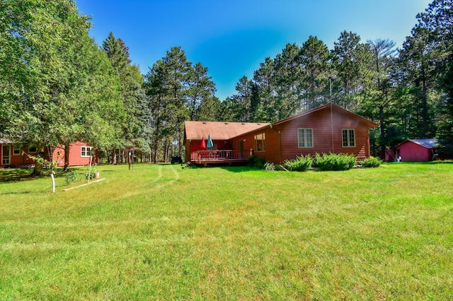 view of yard featuring a wooden deck