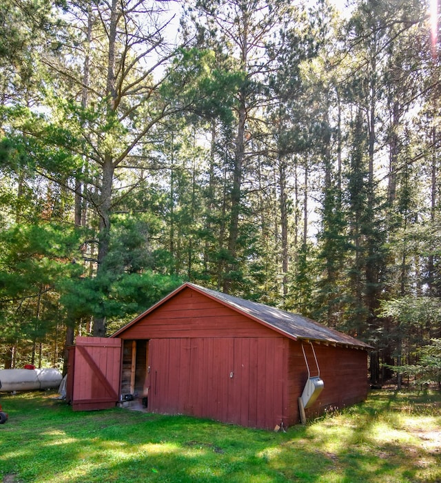 26451 US-71, Arago Twp, MN 56470 - view of pole building featuring a yard and a forest view