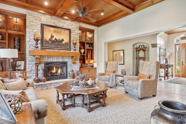 living room with coffered ceiling, beamed ceiling, a fireplace, and wooden ceiling