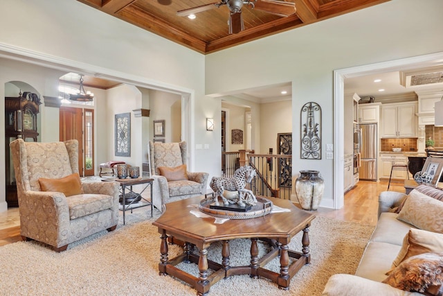 living room featuring crown molding, coffered ceiling, light wood-type flooring, and wood ceiling