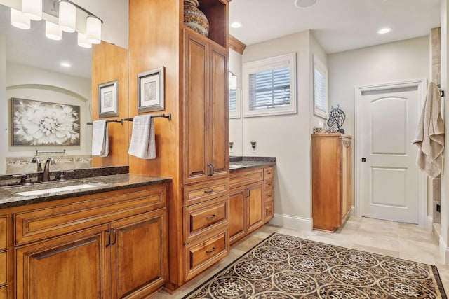 bathroom with vanity and tile patterned floors