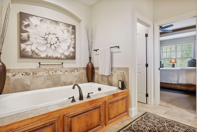 bathroom with a washtub and ceiling fan