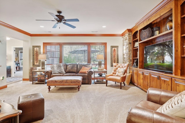 living room featuring ceiling fan, light carpet, built in features, and ornamental molding