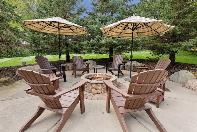 view of patio with an outdoor fire pit