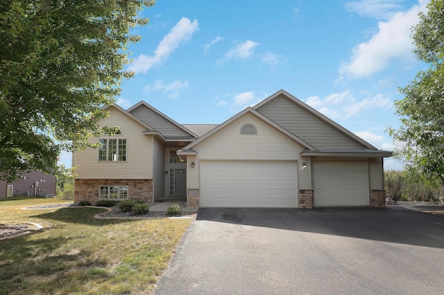 view of front of home featuring a front lawn and a garage