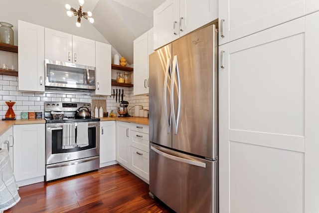 kitchen with white cabinetry, light countertops, open shelves, and stainless steel appliances