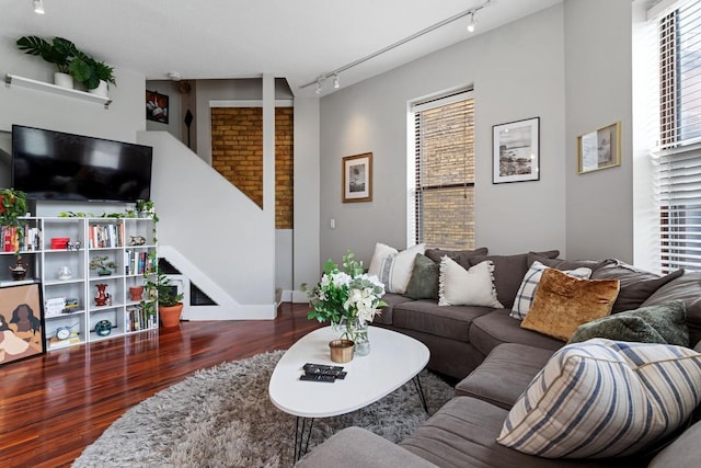 living room featuring track lighting and hardwood / wood-style flooring