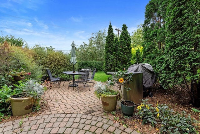 view of patio featuring outdoor dining area