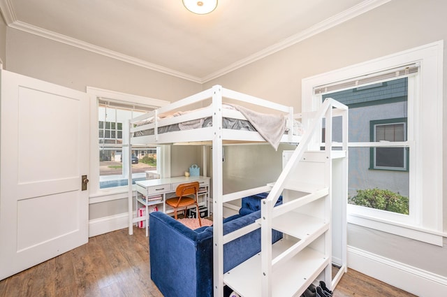 bedroom featuring hardwood / wood-style flooring and ornamental molding