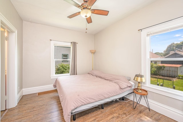 bedroom featuring hardwood / wood-style flooring and ceiling fan