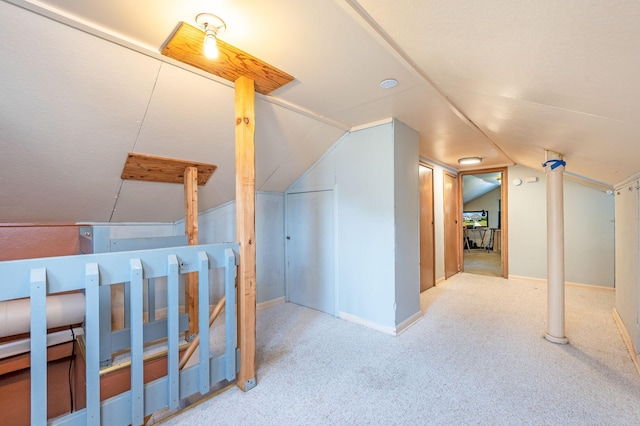 additional living space with carpet floors and lofted ceiling