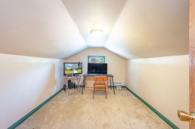 office area featuring light colored carpet, a baseboard radiator, and vaulted ceiling