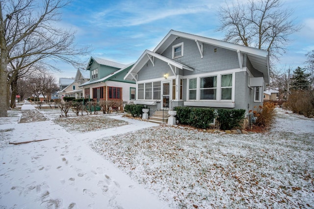 view of front of house featuring a sunroom