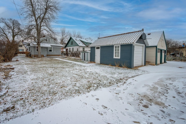 exterior space featuring an outbuilding and a garage