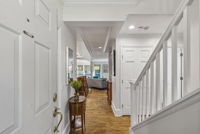 entrance foyer with hardwood / wood-style flooring and crown molding