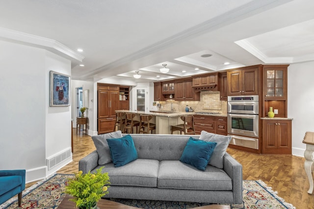 living room featuring ornamental molding, hardwood / wood-style floors, and beamed ceiling