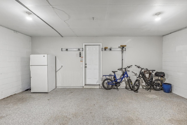 garage with white refrigerator