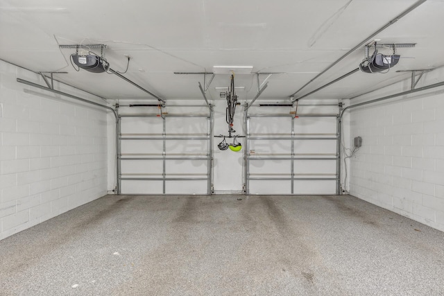 garage featuring a garage door opener