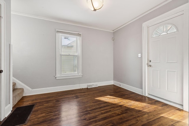 entryway with dark wood-type flooring and ornamental molding